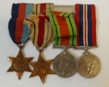 GROUP OF FOUR WORLD WAR II MEDALS, viz 1939 - 45 War and Defence Medals, 1939 - 45 Star and the