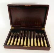 A CASED SET OF SIX PAIRS OF FISH EATERS, with ivorine handles and silver ferrules, Sheffield 1928