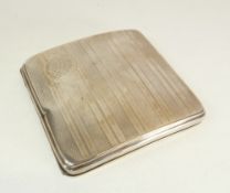 AN ENGINE TURNED SILVER SQUARE CIGARETTE CASE, Birmingham 1924, 3.30oz