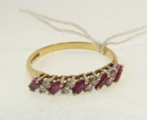 AN 18CT GOLD, RUBY AND DIAMOND RING, set with a row of five small diagonally set baguette cut rubies