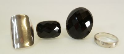 TWO SILVER RINGS SET WITH LARGE BLACK CHECKER BOARD BLACK STONES, A LARGE RECTANGULAR SILVER RING