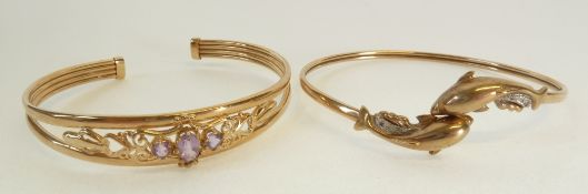 A 9CT GOLD DOLPHIN PATTERN TORQUE BANGLE, Birmingham, AND A GOLD BANGLE, SET WITH THREE PINK STONES,