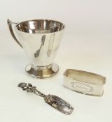 A SILVER CHRISTENING MUG, conical form, the angular handle with thumb-piece, raised on a cicular