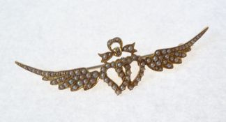A BESPOKE SEED PEARL SET GOLD R.A.F. SWEETHEART BROOCH, interlocked hearts, topped with a bow and