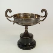 A SMALL SILVER TWO HANDLED TROPHY CUP, shallow with double scroll handles, Birmingham 1928, 3 ½" (