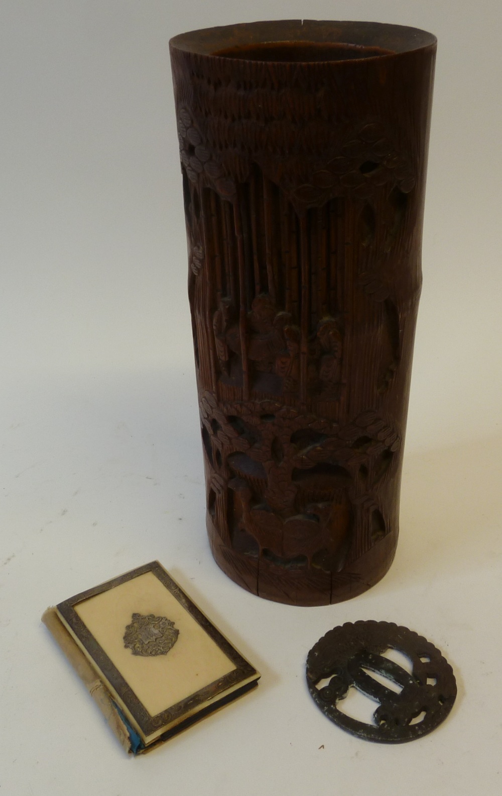 A LARGE CARVED BAMBOO BRUSH POT, carved in relief with birds and figures in a bamboo forest, 11 ½""