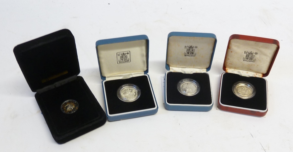 THREE UK ROYAL MINT SILVER PROOF QUEEN ELIZABETH 11 ONE POUND COINS 1983, 1985 & 1986 and a POBJOY