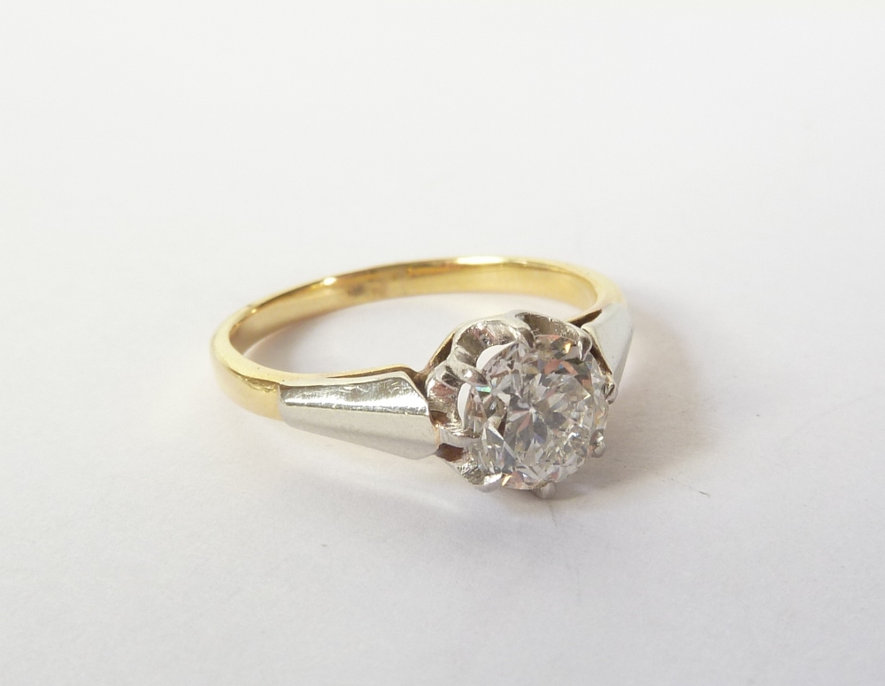 A YELLOW GOLD AND PLATINUM (UNMARKED) SOLITAIRE DIAMOND RING, the stone approximately 0.80 carat