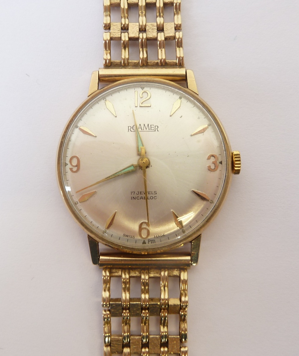 A GENT`S ROAMER 9CT GOLD CASED WRIST WATCH, the silvered Arabic dial with batons and luminous