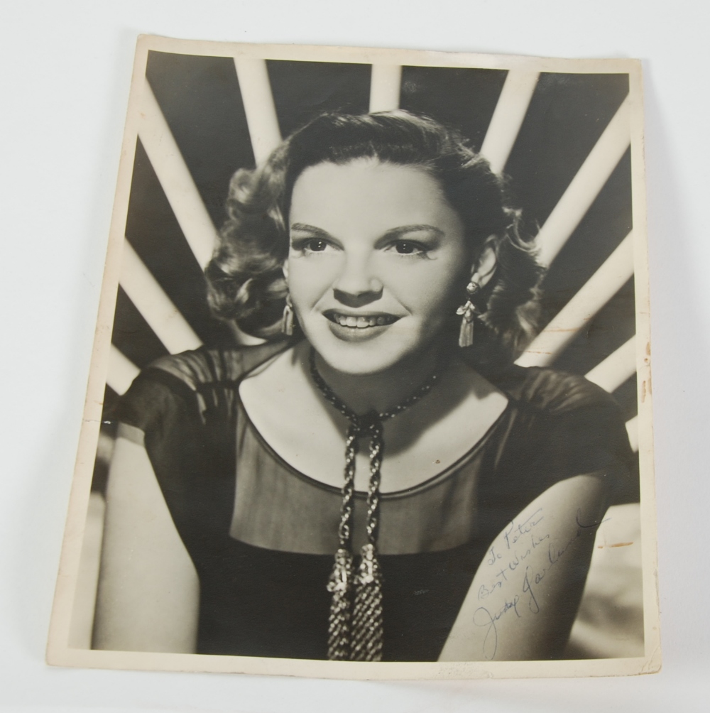 CIRCA 1950`s JUDY GARLAND SIGNED AND INSCRIBED, 8" x 10" (20.3cm x 25.4cm) BLACK AND WHITE HEAD