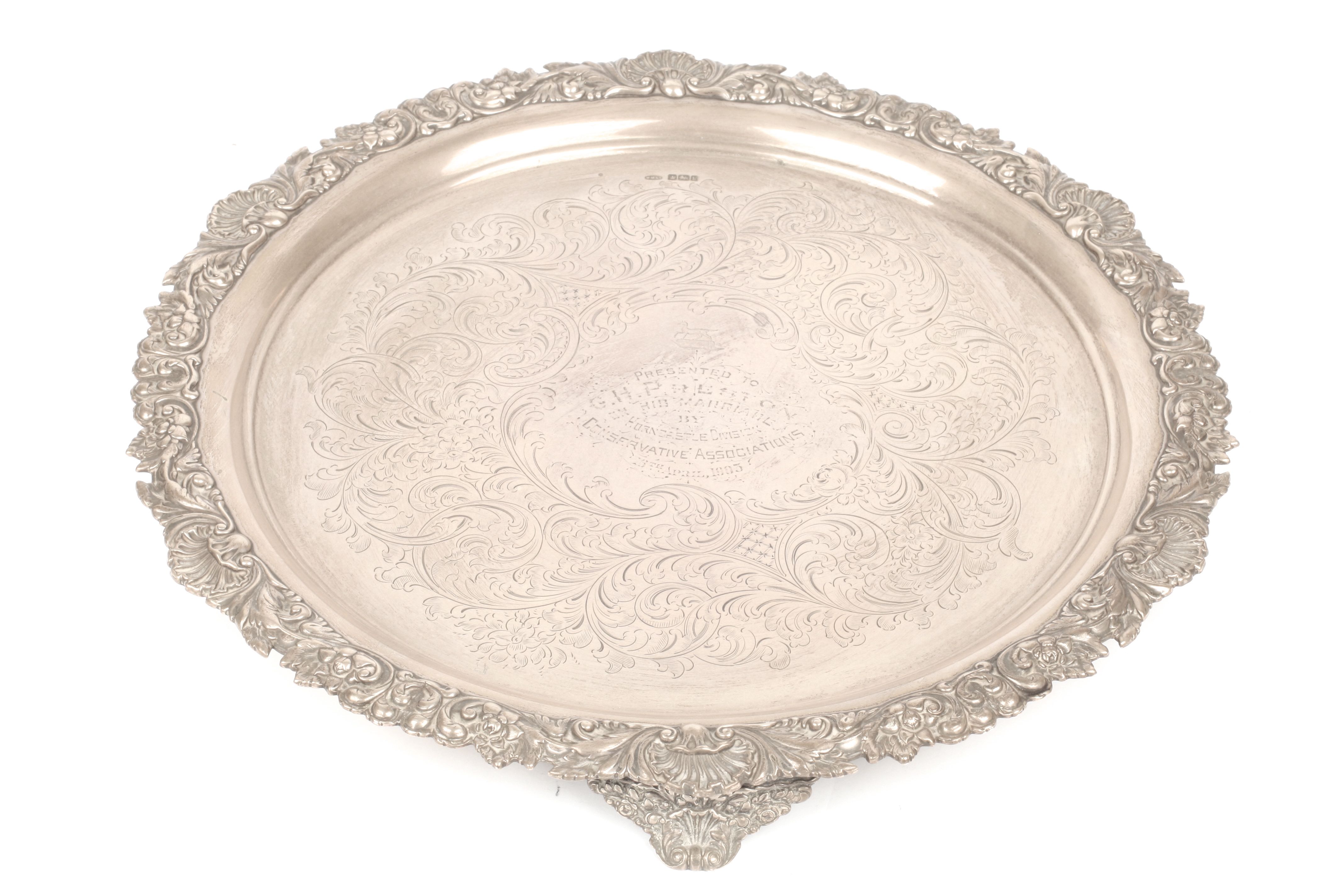 An Edwardian silver salver with flower embossed rim, hallmarked Sheffield 1902, the centre engraved - Image 2 of 2