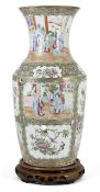 A large 19th century Chinese Canton enamel vase, in the famille rose palate, decorated with panels