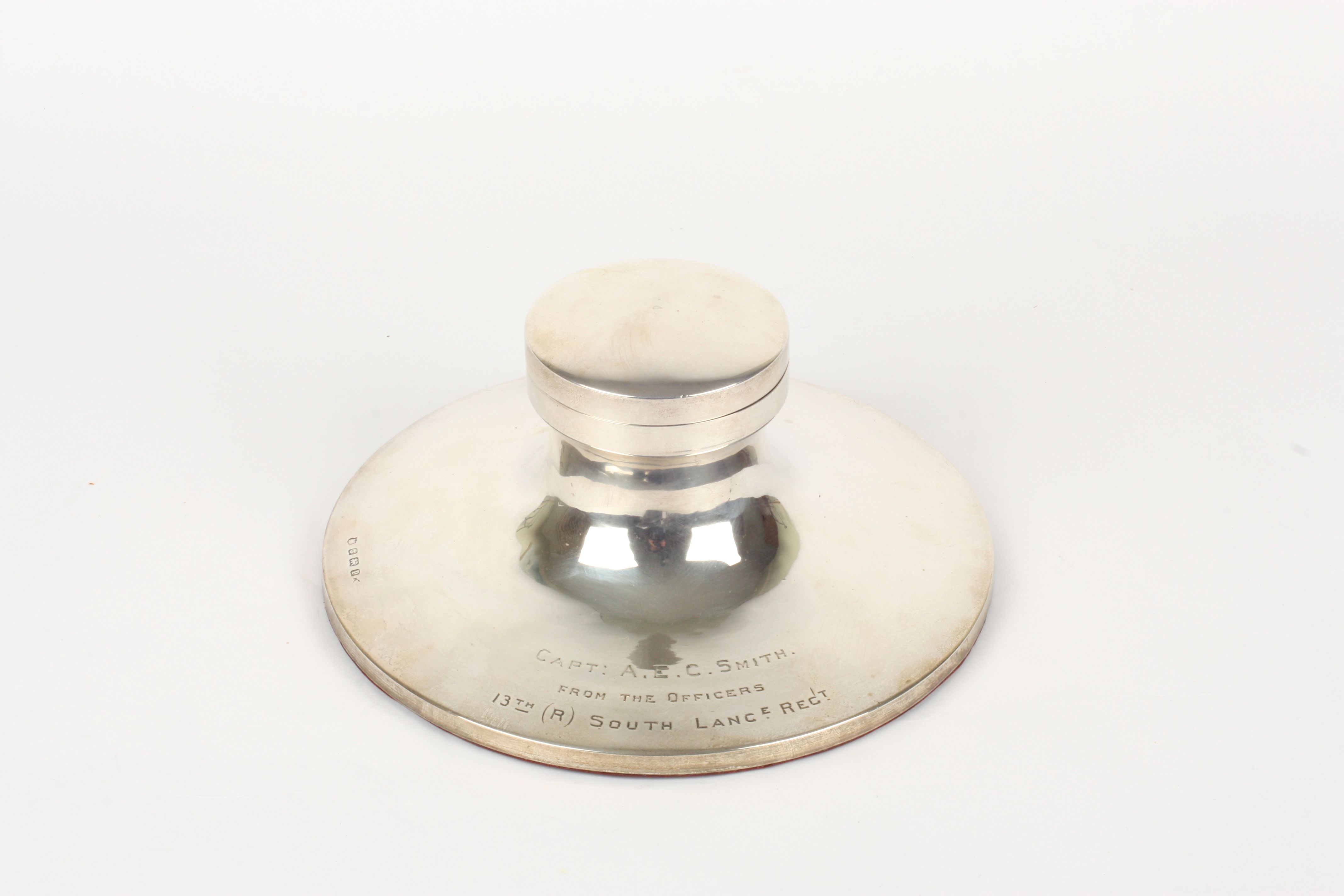 A very large silver inkwell in the form of a capstan, hallmarked Birmingham 1939, with inscription