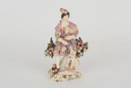 An 18th century Chelsea porcelain figure of a man, wearing finely painted coloured and gilded