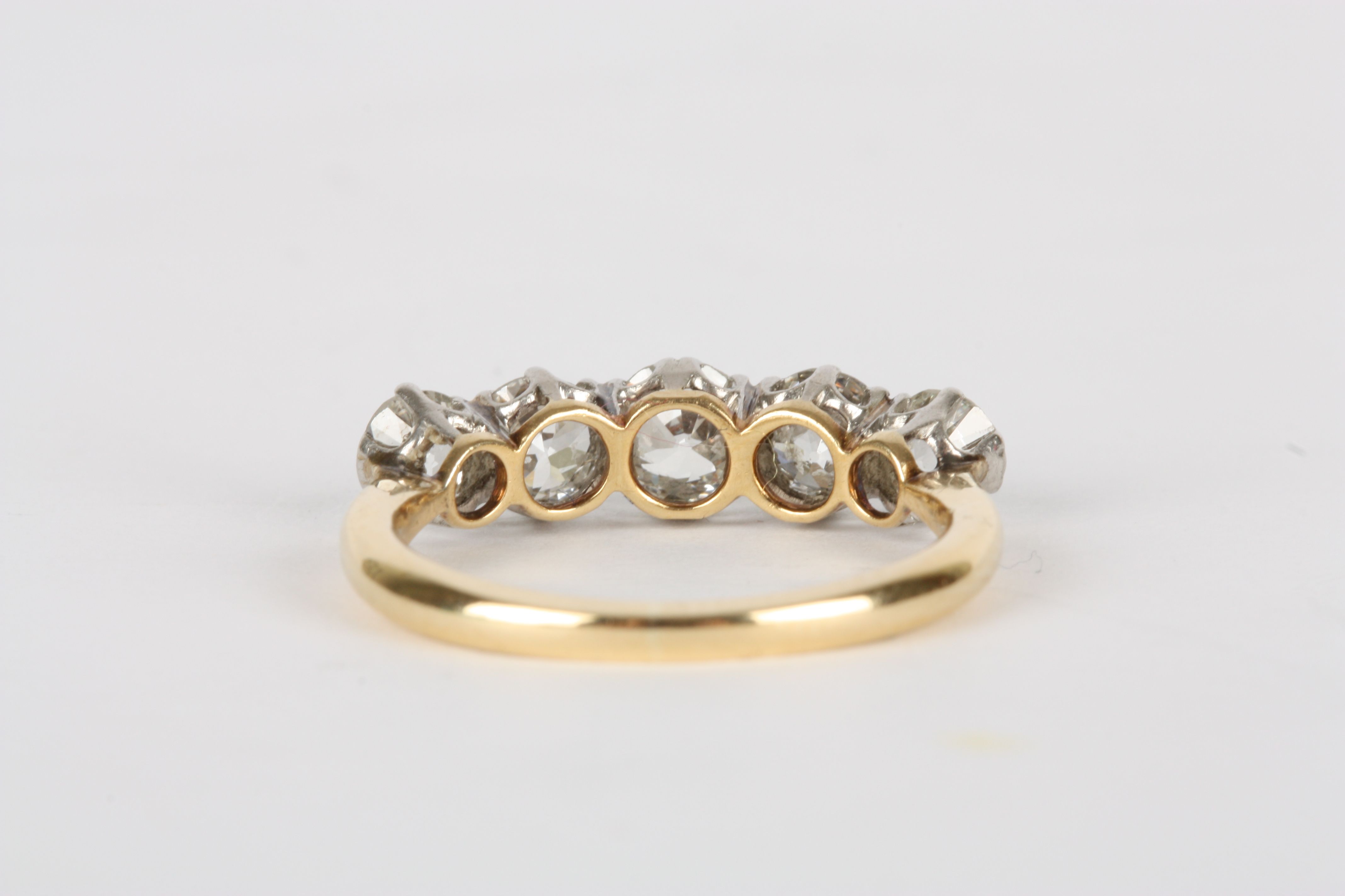 A five stone diamond ring set in 18ct yellow gold and platinum, the central stone of approximately - Image 2 of 2