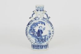 A 19th century Chinese blue and white moon flask, the body decorated with panels of figures in