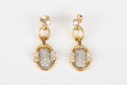 A pair gold coloured metal and diamond drop earrings, with double loop set with numerous diamonds,