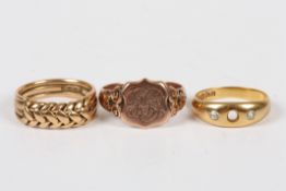 Three gentleman?s gold rings, comprising an 18ct gold keeper ring, a 9ct gold shield shaped signet