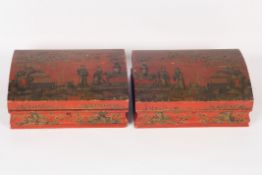 A pair of early 20th century Japanese red lacquer boxes, with domed lids, decorated all over with