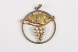 A gold coloured metal circular vine pendant, the grapes formed from seed pearls, unmarked, 2.5cm