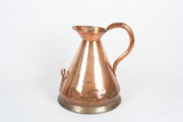 A Victorian four gallon copper flask, of conical form with large loop handle, with smaller carrying