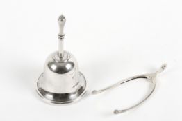 An Edwardian silver table bell and a pair of novelty wishbone sugar nips, the bell hallmarked