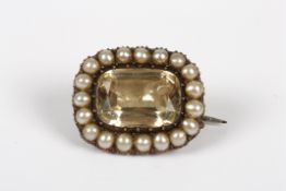 A Georgian citrine and seed pearl oval brooch, with deep dished mount, 2cm wide  Good condition.