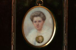 An Edwardian miniature portrait of Lucy Feld, painted on ivory, the sitter with her hair up and