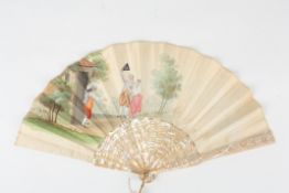 A late 19th century Spanish mother of pearl fan, painted on one side with scene of figures in a