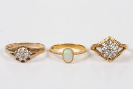 Three gold rings, comprising: a 22ct gold and opal ring; an illusion set 18ct gold and diamond