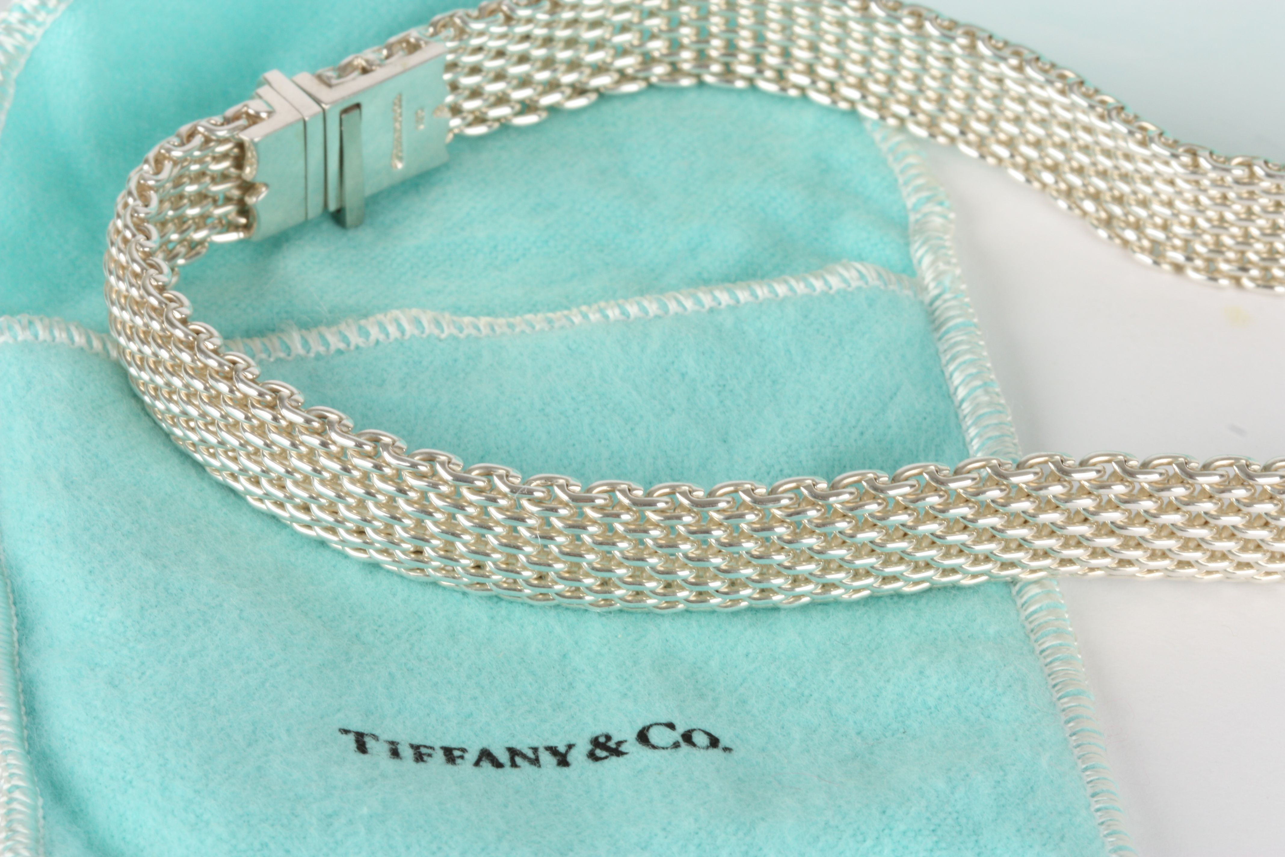 A Tiffany Sterling Silver necklace, of plain linked form, in original gift box, pouch and with - Image 2 of 2