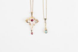 An Edwardian Art Nouveau style 9ct gold and garnet pendant on chain, and a smaller gold, aquamarine