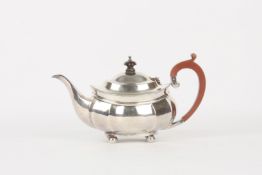 A George VI oval silver teapot, hallmarked Birmingham 1938, the body of fluted form, with gadrooned