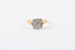 An 18ct gold square shaped ring, set with nine small diamonds in circular settings  In good overall