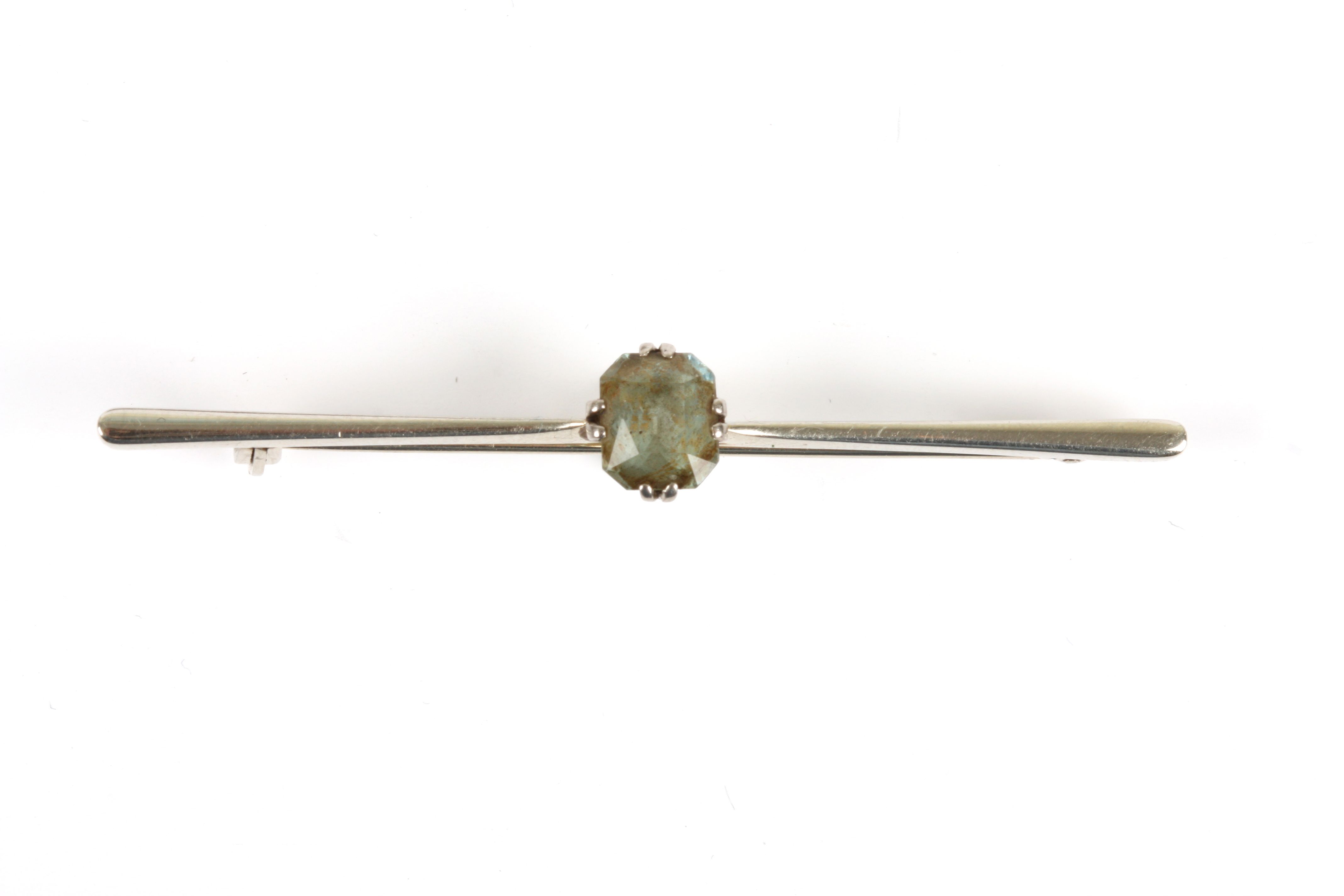 An 18ct white gold and aquamarine bar brooch, in a fitted case retailed by Franklin & Hare of