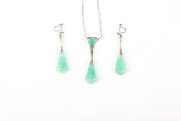 A jade coloured pendant and earring set, the carved pendant on silver and marquasite chain link