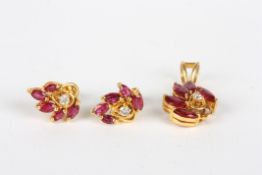 A ruby and diamond suite of leaf shaped jewellery, comprising a pair of leaf shaped earrings set