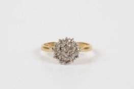 A small 18ct yellow gold and diamond cluster ring, the head set all over with small diamonds, on a