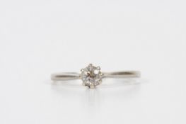 A white gold and diamond solitaire ring, the stone weighing approximately .20cts. Unmarked, size L