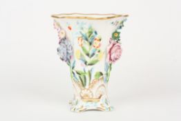 A 19th century Spode porcelain encrusted vase, the body with flared neck and encrusted all over