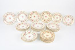 A set of Coalport Felspar porcelain plates, painted with flowers and gilt highlights, comprising: