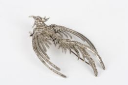 A silver and marquasite phoenix shaped brooch, set with numerous marquasite stones, stamped on the