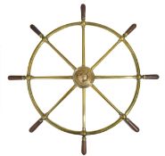 An eight spoke brass ships wheel, with central brass hub inscribed BROWN BROS. & CO Ltd ROSEBANKS