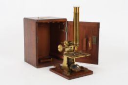 A brass Negretti and Zambra monocular microscope, late 19th century, signed on the Y shaped base,