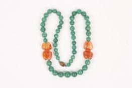 A long Chinese jade coloured necklace, with silver gilt clasp and two coloured stone inserts  In