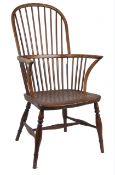 An elm Windsor stick back chair, with shaped elm seat  With general wear and tear but no major