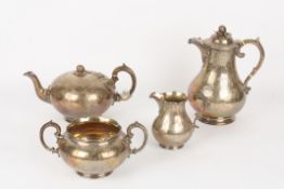 A Victorian silver four piece tea set, hallmarked London 1851, comprising: melon-shaped teapot,