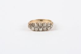 A Victorian 18ct gold sixteen stone diamond ring, with old cut diamonds, carved shoulders and claw