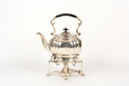 A George V silver spirit kettle on stand, hallmarked Sheffield 1912, with scrolled and ebonised