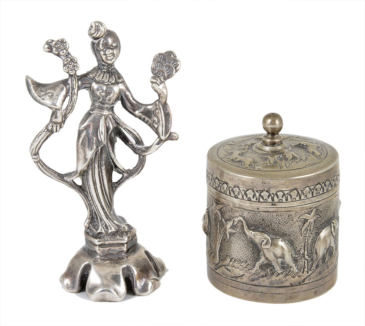 An Indian white metal embossed box and cover, decorated with elephants and other animals, together